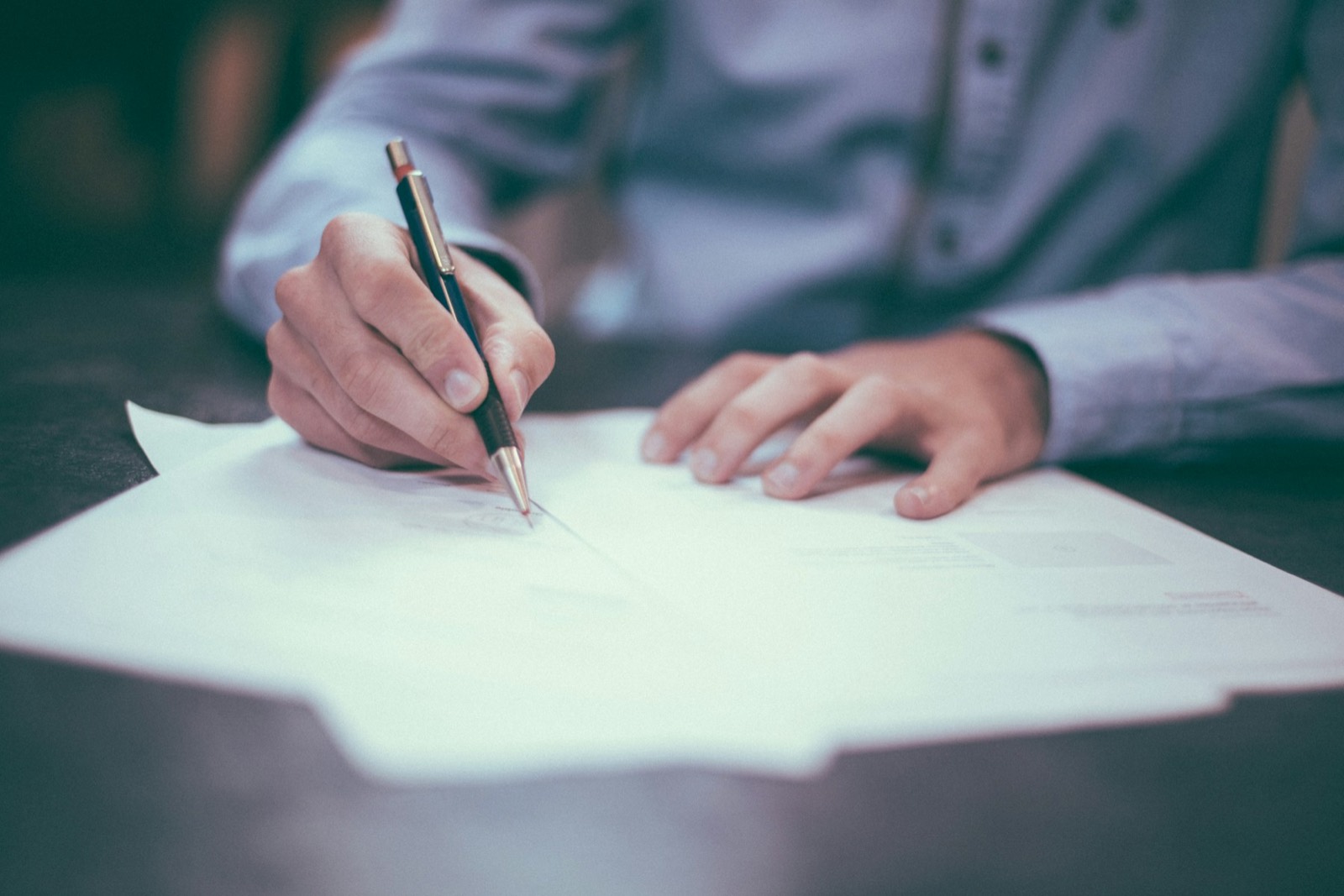 Signing an insurance policy document